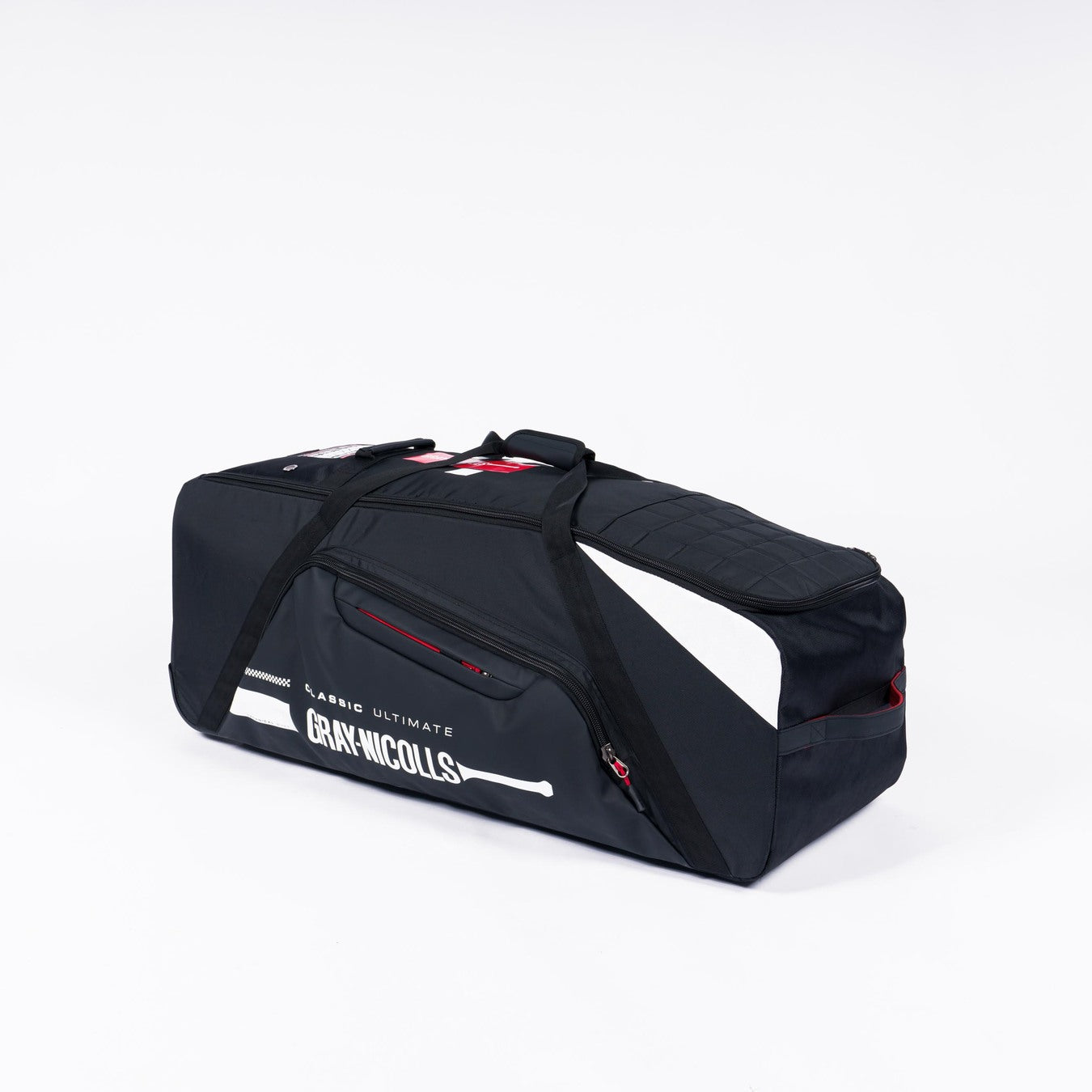 The Gray Nicolls Classic Ultimate Wheelie 2026 is a large black sports duffel with white accents, side pockets, and black handles. Featuring Gray Nicolls branding and a bat graphic, this wheelie bag is shown on a plain white background.
