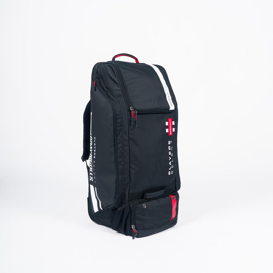 The Gray Nicolls Select Wheelie/Duffle 2026 is a large cricket kit bag featuring white stripes, red accents, a red-and-white cross logo, multiple zippered compartments, and a top carrying handle for easy gear organization.