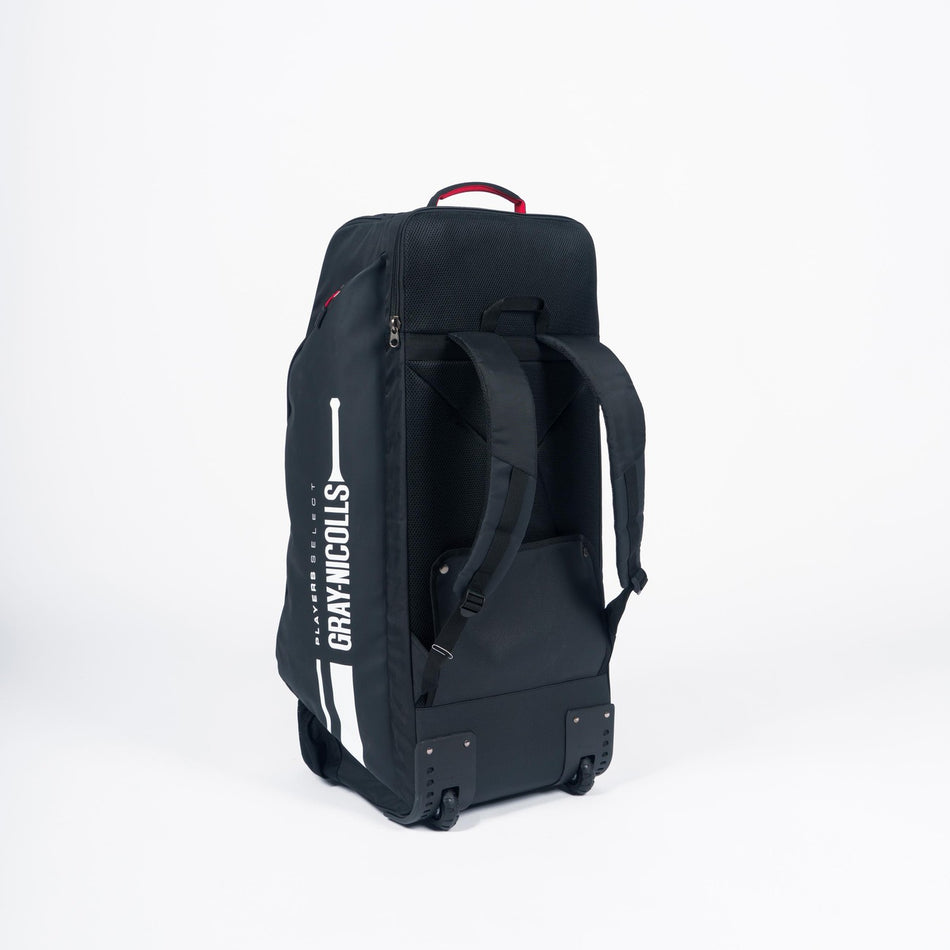 The Gray Nicolls Select Wheelie/Duffle 2026, a spacious black bag with backpack straps and wheels, displays the Gray Nicolls logo and cricket bat graphic on its side as it stands upright against a plain white background.