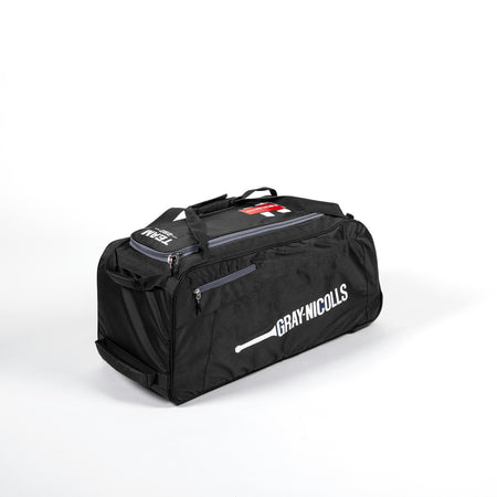 A Black/Grey Gray Nicolls Team 250 Wheelie Bag 2026 cricket kit bag with zippered compartments, carrying straps, and a white brand logo on the side, displayed on a plain white background.