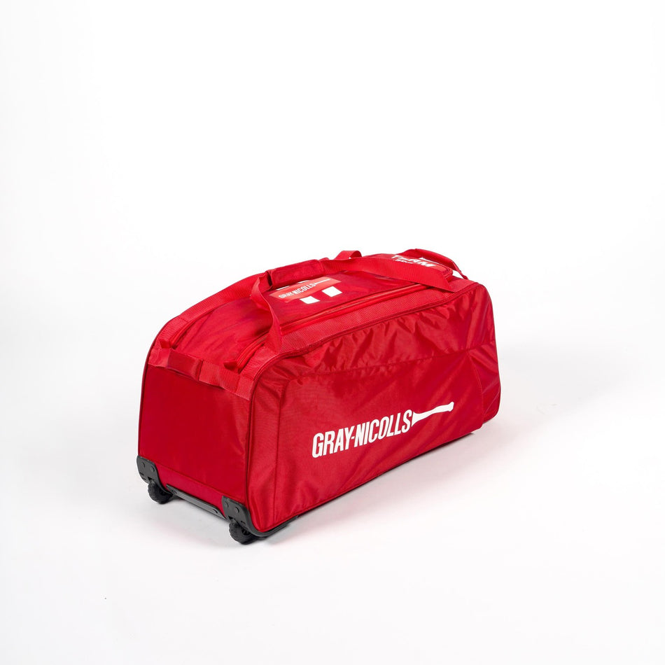 The Gray Nicolls Team 250 Wheelie Bag 2026 is a spacious red cricket bag, featuring a white bat logo and designed for carrying your kit in style. This bold Gray Nicolls bag stands out against a plain white background.