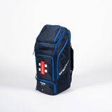 The Gray Nicolls Team 800 Duffle Bag 2026 is a large navy duffle with blue accents, multiple zippered compartments, a shoe pocket, and a red and white label on the front. It offers ample storage and stands upright on a plain white background.