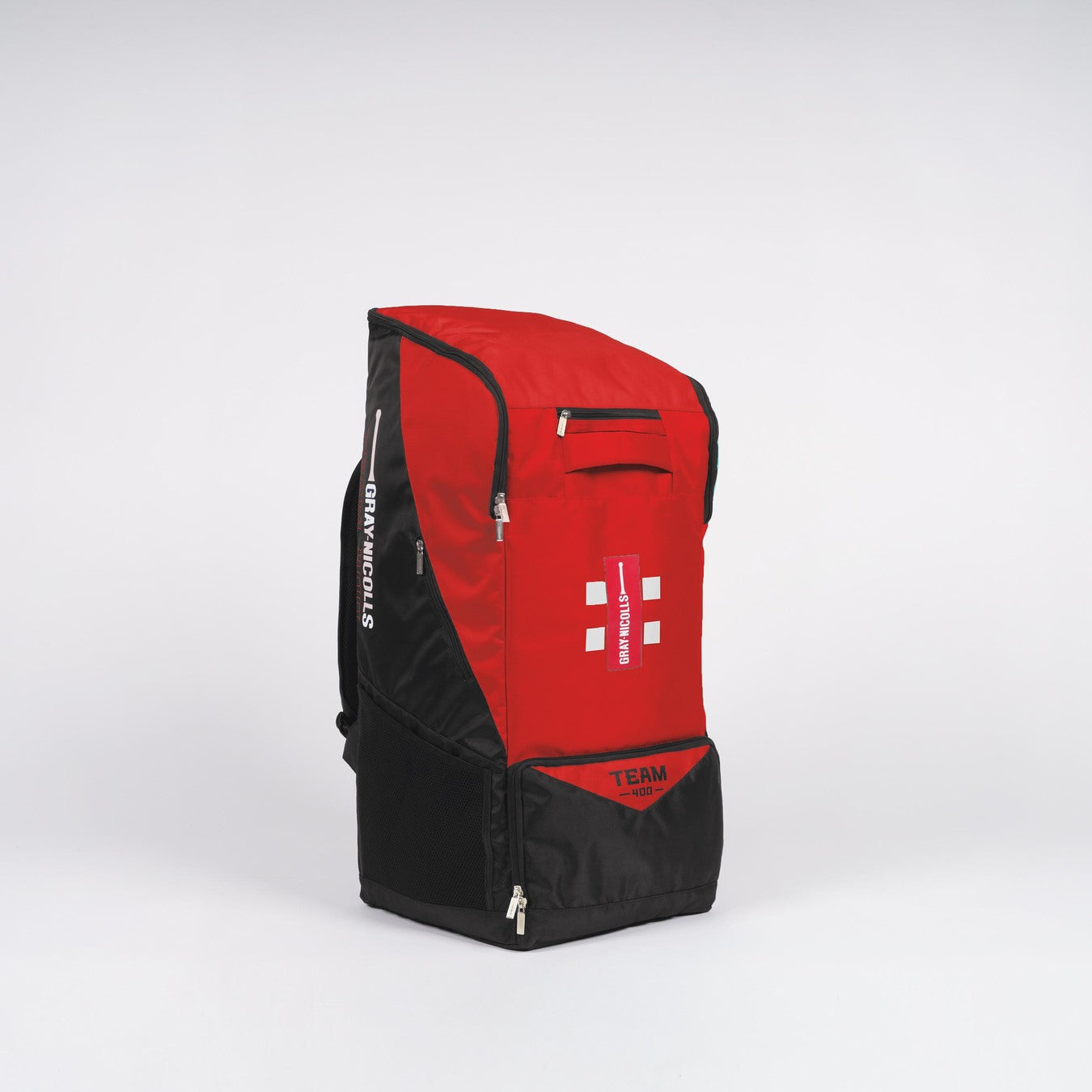 The Gray Nicolls Team 400 Duffle is a large black and red sports backpack with white accents, upright on a plain white background. It features the Gray Nicolls logo, side mesh pockets, zippered compartments, and internal bat storage.