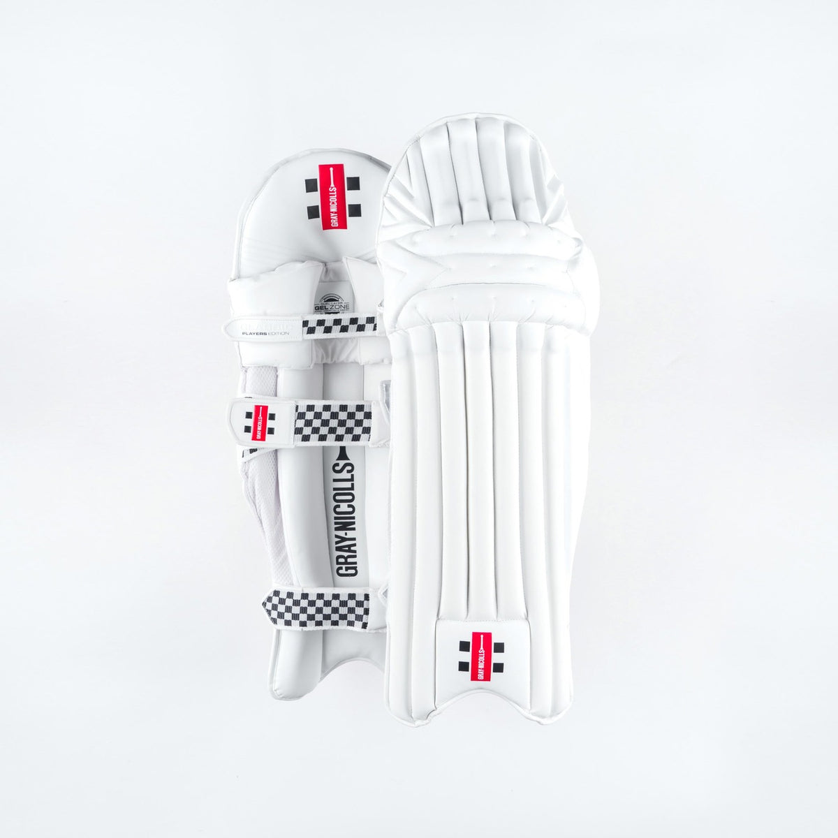 The Gray Nicolls Classic Players Edition Batting Pads 2026 are white leg guards with black and red branding, checkered straps, and lightweight HDF multi-layer protection, shown against a plain white background.