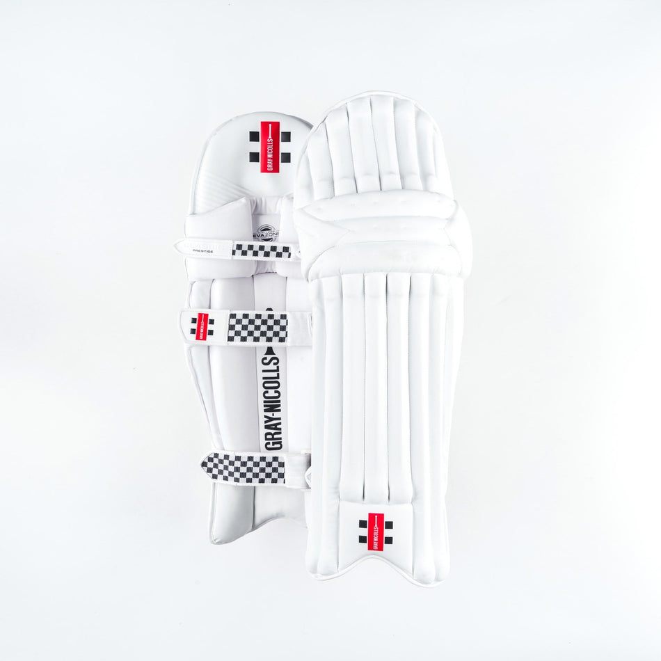 The Gray Nicolls Classic Prestige Batting Pads 2026, in white, are lightweight with padded straps and multilayer protection, shown on a plain white background.