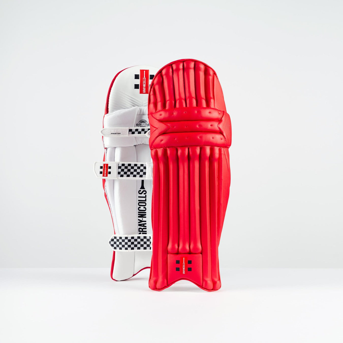 The Gray Nicolls Classic Prestige Batting Pads 2026 feature a bright red color, a textured multi-layer front for added protection, and secure padded straps. Brand: Gray Nicolls.