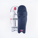 Two Gray Nicolls Classic Select Batting Pads 2026 in navy are shown side by side on a white background, with one displaying the front and the other showing the back with straps, branding, and padding for comfort.