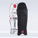 The Gray Nicolls Academy Coloured Batting Pads - GEM in black stand upright side by side, showing branding and straps—a stylish option for women’s cricket gear. The background is plain light grey.