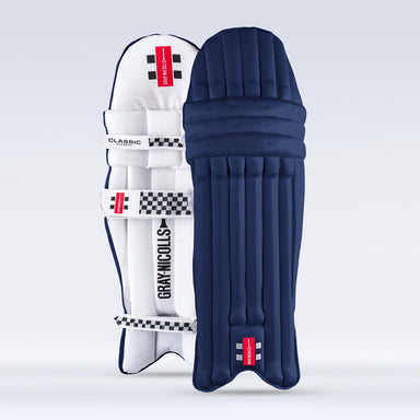 Two Gray Nicolls Academy Coloured Batting Pads - GEM stand upright against a light background—one is white with black and red details, the other is navy with a red and white Gray Nicolls label near the bottom.