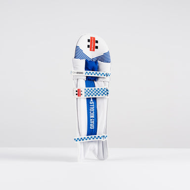 The Gray Nicolls GN200X Batting Pads 2026 feature a white finish with blue accents, checkered blue and white straps, and a red label—perfect club-level cricket gear for dependable protection against fast bowling.