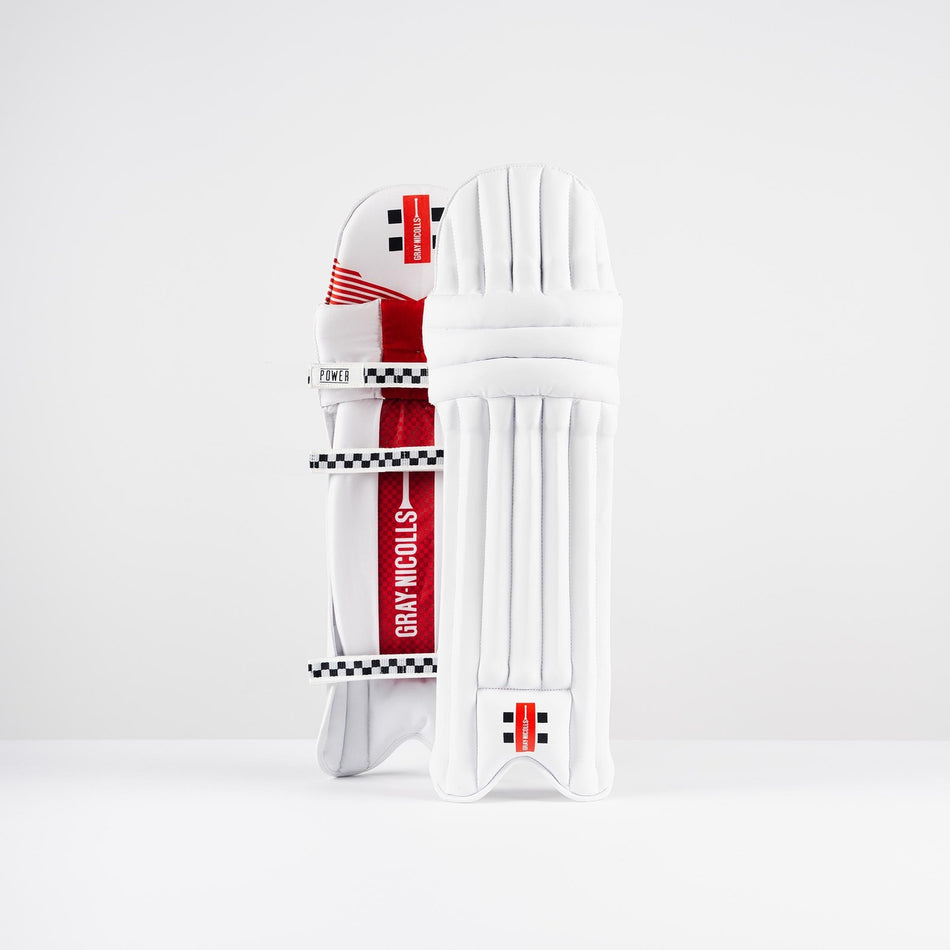 The Gray Nicolls Power X Batting Pads 2026 feature a white design with red and black accents, showcasing the iconic brand logo. One lightweight pad is shown front-facing, while the other displays the back straps for cricket protection.