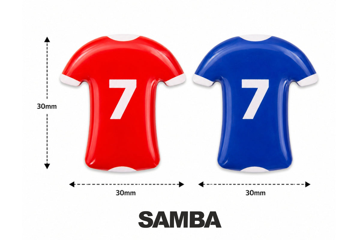 Two flat magnets shaped like soccer jerseys—one red and one blue—each featuring a white number 7 and measuring 30mm by 30mm, are displayed. Below them, “SAMBA SPORTS” is boldly printed in black. Ideal for tactics boards, these magnetic player markers from the Football Coaching Board Shirt Magnets Set of 27 by Samba Sports are perfect for any football coaching board.