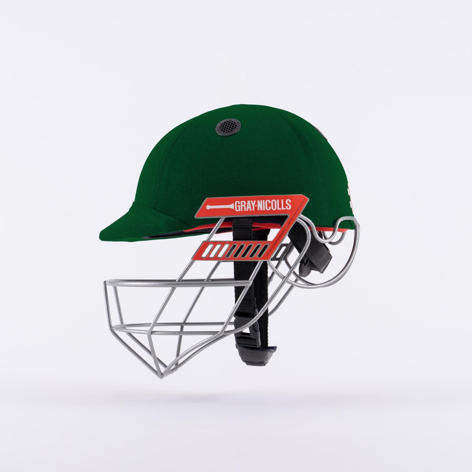 The Gray Nicolls Ultimate 360 Pro Cricket Helmet in green features a titanium grille, metallic face guard, and a red Gray Nicolls logo on the side, shown against a plain white background.