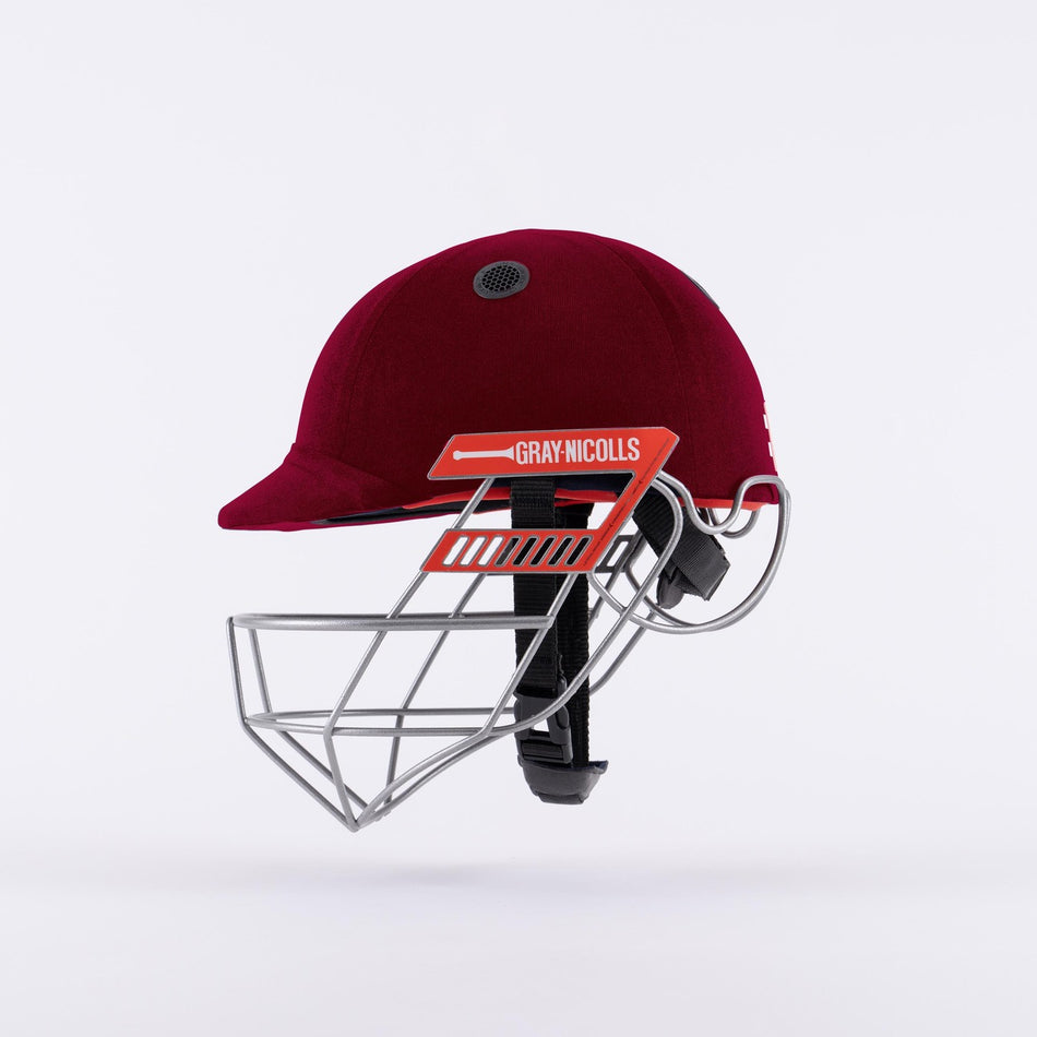 The Gray Nicolls Ultimate 360 Pro Cricket Helmet in maroon, featuring a titanium grille and the Gray Nicolls logo on the side, is displayed against a plain white background.