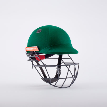The Gray Nicolls Atomic 360 Helmet in green features a black metal faceguard and a red and white side label. Displayed on a plain white background, this helmet by Gray Nicolls offers essential protection for cricketers.