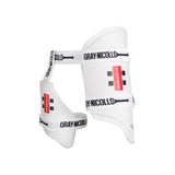 The Gray Nicolls Players Edition 360 Thigh Pads are white thigh guards with adjustable straps, black Gray Nicolls branding, and high-density EVA for superior upper leg protection during play.