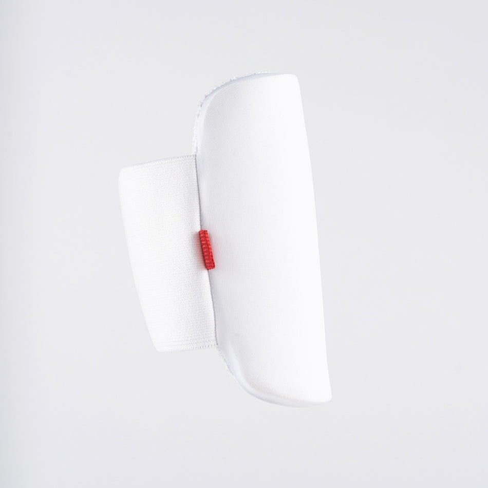 A white Gray Nicolls Mini Pro Edition Arm Guard with a red tab on the side, shown against a plain light gray background—ideal for junior cricket protection.