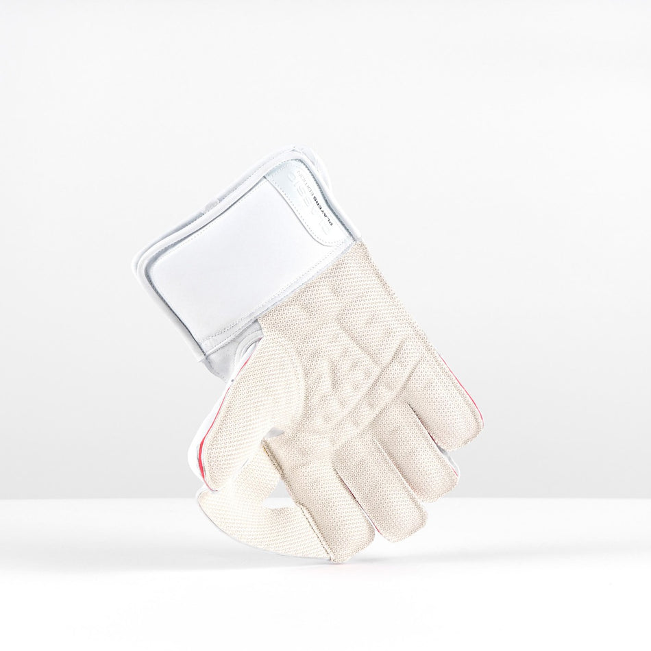 The Gray Nicolls Classic Players Edition WK Gloves 2026 are premium white leather cricket gloves with octopus grip padding on the fingers and palm, and a wide wrist strap, shown standing upright on their cuffs against a plain background.