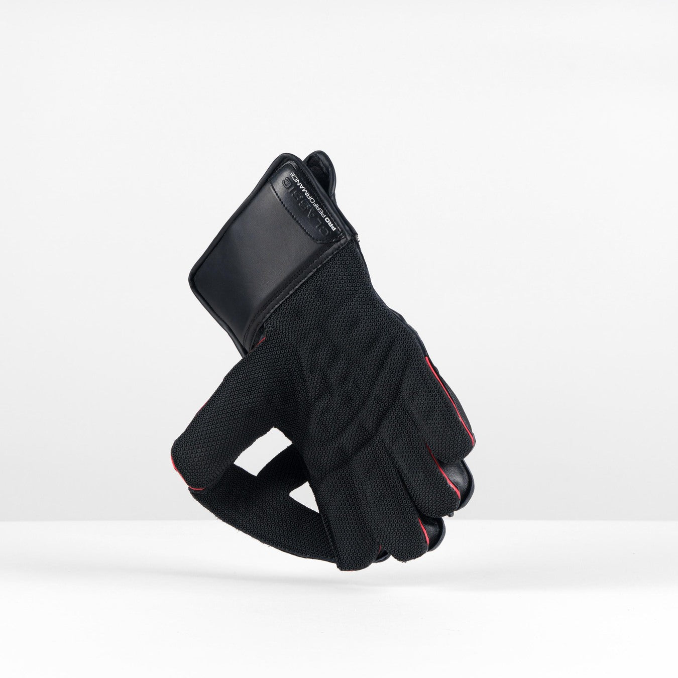 A single Gray Nicolls Classic Pro Performance WK Glove 2026 stands upright on a white surface with a plain white background, featuring Octopus grip textured fabric, a padded cuff, and showcasing high-quality Gray Nicolls craftsmanship.