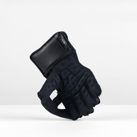 The Gray Nicolls Classic Elite WK Glove 2026 is shown upright on a white surface, fingers curled in a fist. Made by Gray Nicolls, this wicket keeping glove has Pro Palm Fit and stands out against a plain light gray background.