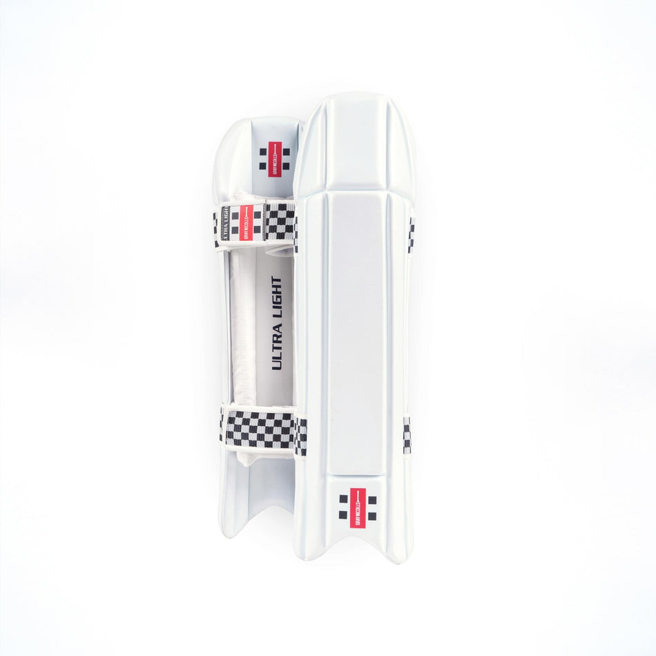 The Gray Nicolls Super Lite WK Pads 2026 are lightweight wicketkeeping pads featuring a white design with black and white stripes and durable EVA foam for reliable shin protection.