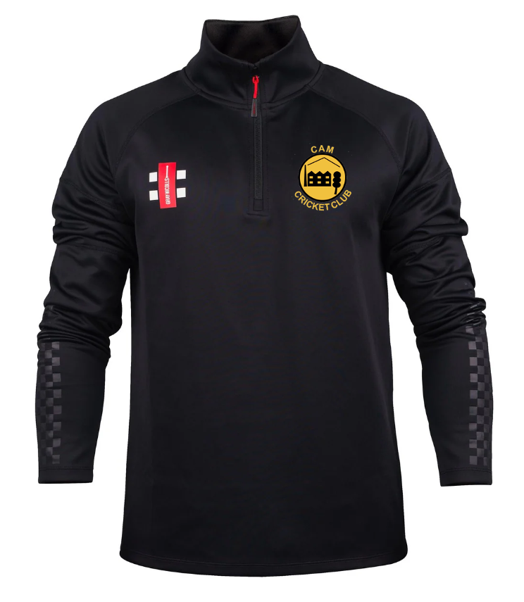 The Gray Nicolls Cam CC Pro Thermo Fleece is a black long-sleeve cricket pullover with a red half-zip, checkered raglan sleeves, moisture-wicking fleece, a gold CAM Cricket Club logo, and a red and white emblem.