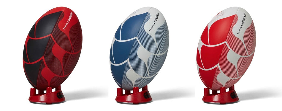 The Canterbury Thrillseeker Rugby Ball by Canterbury, shown in Red/Black on red stands against a white background, is the perfect durable training rugby ball.