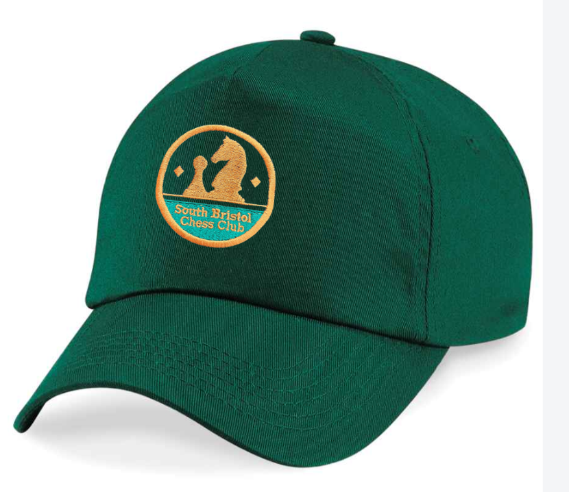 The Checkers Chess Club Cap by Martin Berrill Sports is a bottle green baseball cap with a yellow patch showing a chess knight, pawn, and the text "South Bristol Chess Club.