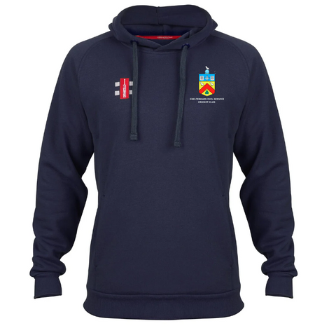 The Gray Nicolls Cheltenham Civil Service CC Velocity Hoodie is navy blue, made from sustainable cotton, features a small multicolor crest and white text on the left chest, a red/white/black rectangle logo on the right chest, drawstrings, and ribbed cuffs.