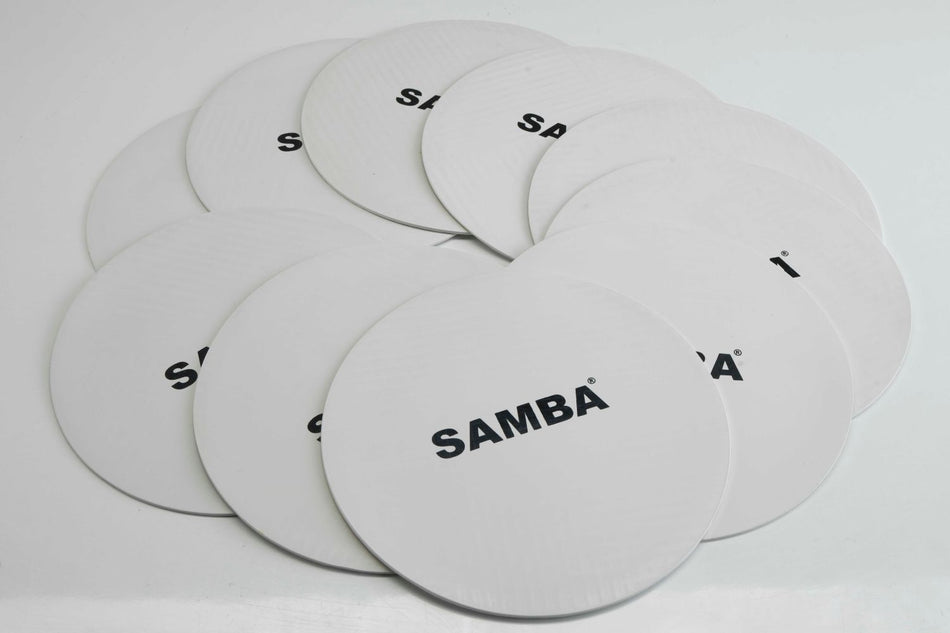 A stack of white Flat Disc Markers by Samba Sports, each printed with the brand name in black, arranged overlapping on a white surface. These non-slip markers are perfect for training session positioning.