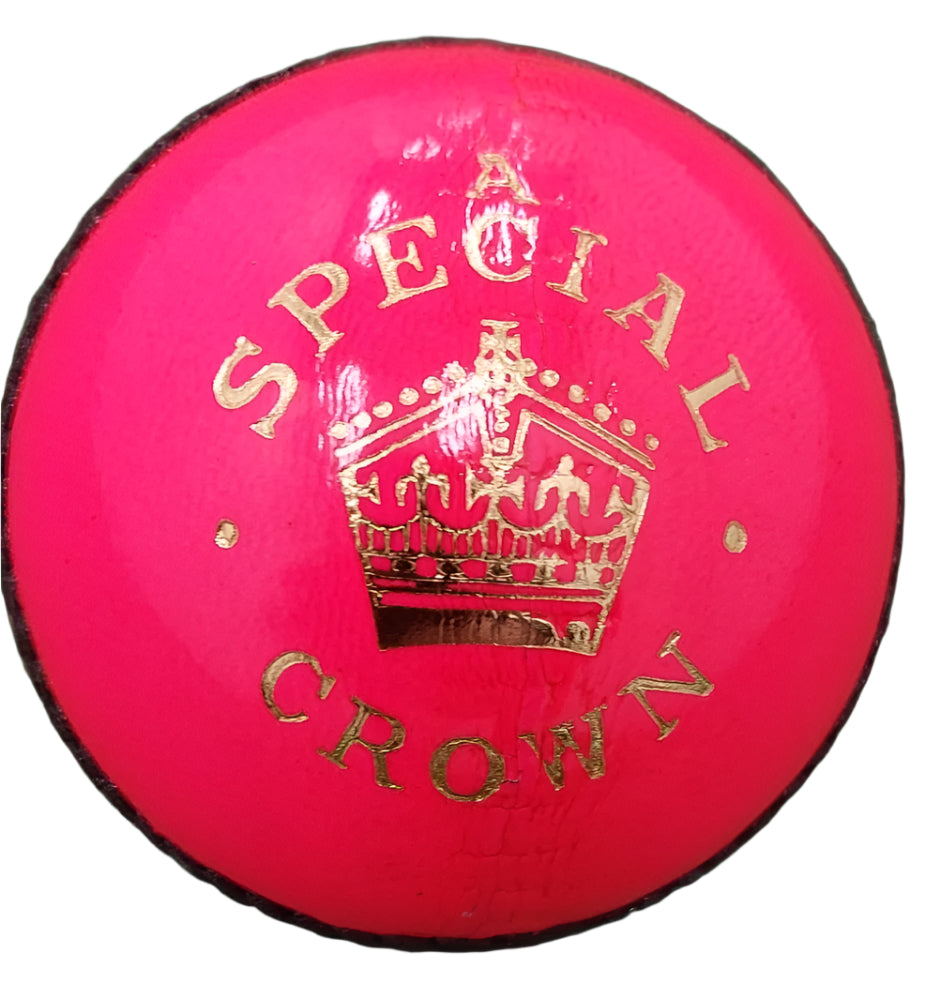 The Dukes Special Crown Cricket Ball (Pink, Senior) is crafted from English leather, features a gold crown graphic, and has "A SPECIAL CROWN" stamped in gold above and below the crown.