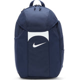 The Nike Academy Team Backpack in Navy/White features a white Nike swoosh, Storm-FIT rain protection, top handle, zippered main compartment, and side pockets.