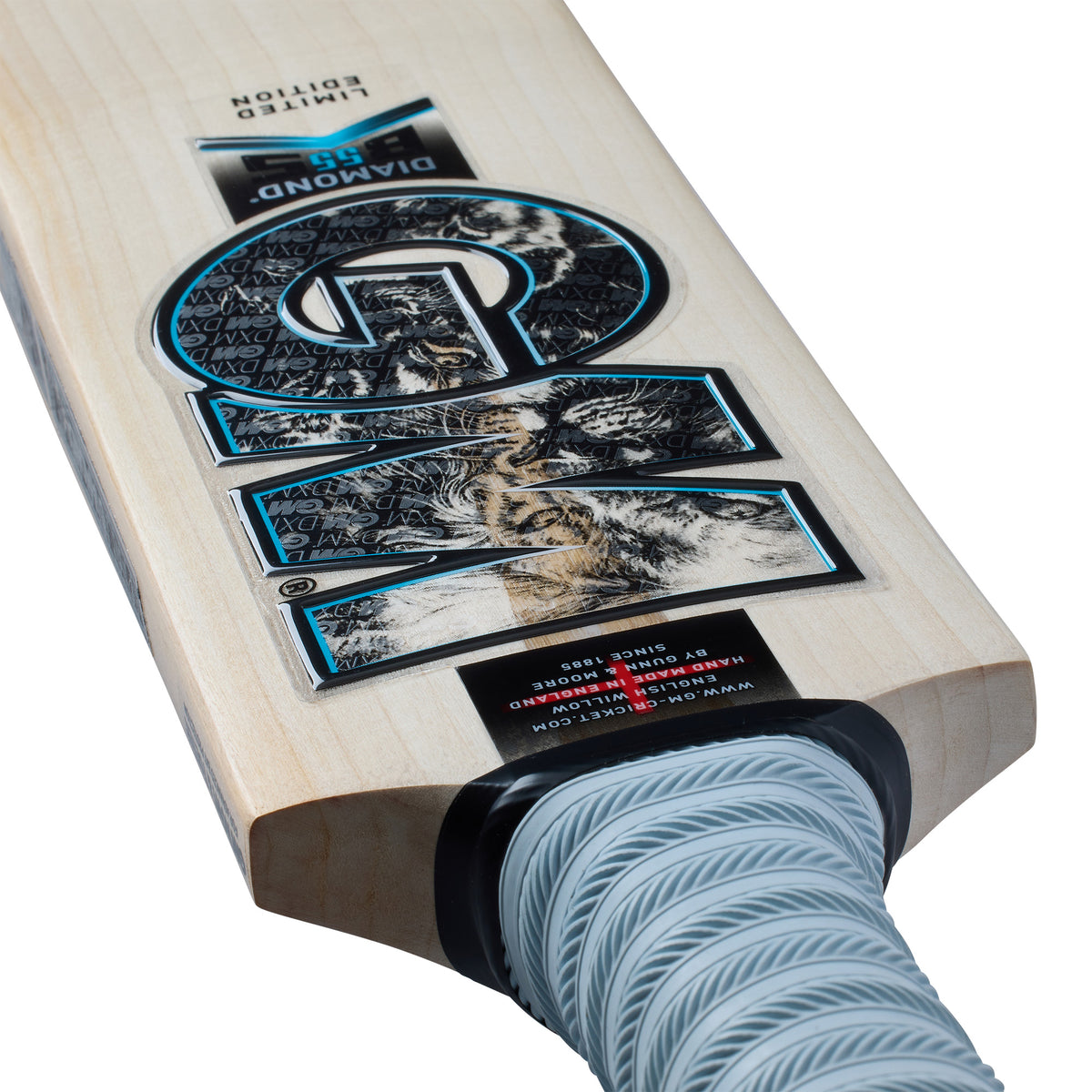 Close-up of the lower part of the Gunn & Moore Diamond DXM Junior Cricket Bat 2026, featuring a gray grip on the handle and detailed Diamond graphics with text and lion imagery on the blade.