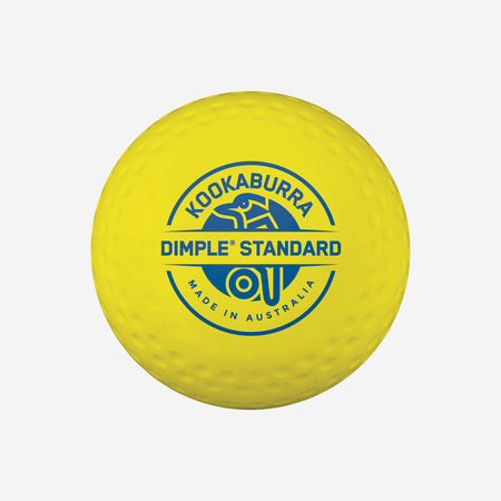 The Kookaburra Dimple Standard Hockey Ball is a yellow ball with the blue Kookaburra logo and "Dimple Standard hockey ball Made in Australia" text, approved for FIH 'National Elite' competitions.
