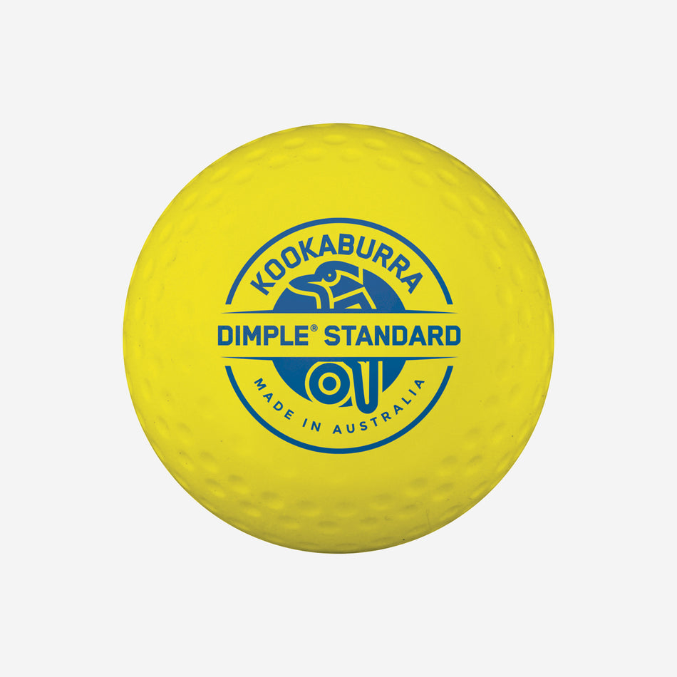 The Kookaburra Dimple Standard Hockey Ball is a yellow ball with the blue Kookaburra logo and "Dimple Standard hockey ball Made in Australia" text, approved for FIH 'National Elite' competitions.
