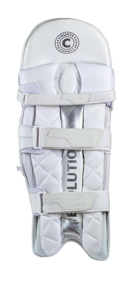 The Hunts County Evolution Batting Pads are white with quilted padding, lightweight PU cover, three adjustable straps, and high-density foam. The Hunts County logo is at the top; "Evolution" appears partially on the shin area.