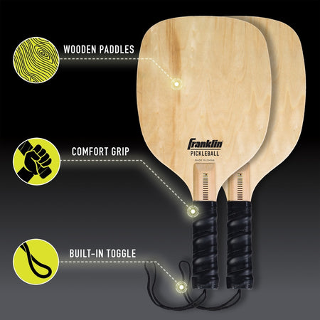 Franklin Pickleball 2 Player Court Set by Franklin: Two wooden paddles with black comfort grips and built-in wrist toggles, ideal for beginners. Highlights include wooden paddles, comfort grips, and built-in toggles—all shown against a dark background.