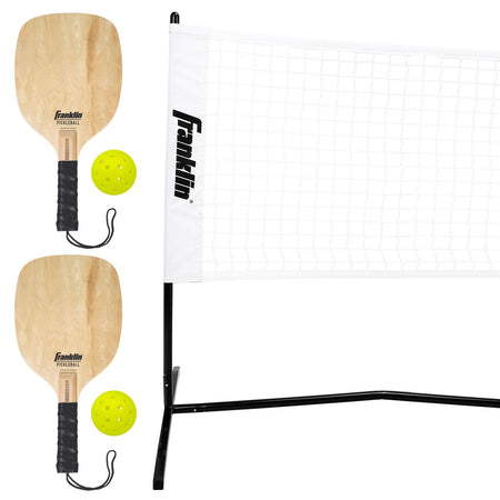 The Franklin Pickleball 2 Player Court Set includes two wooden paddles, two yellow balls, and a portable net with a black frame, all branded Franklin, shown against a white background.