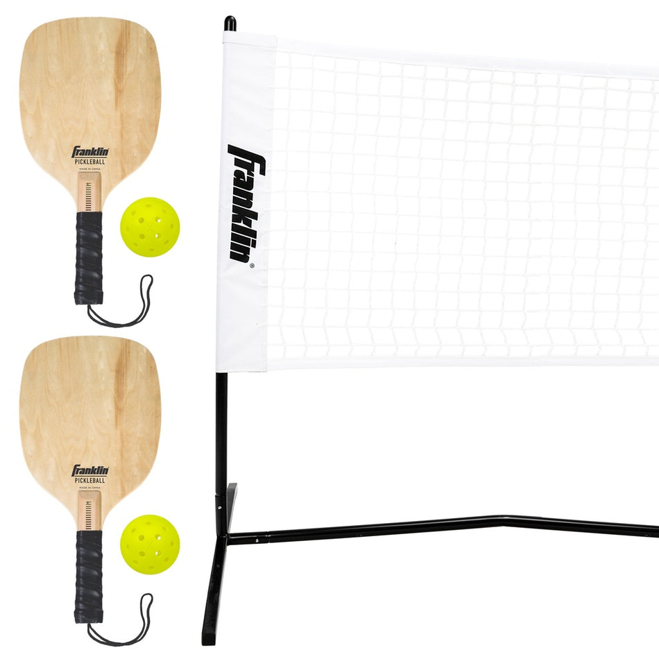 The Franklin Pickleball 2 Player Court Set includes two wooden paddles, two yellow balls, and a portable net with a black frame, all branded Franklin, shown against a white background.