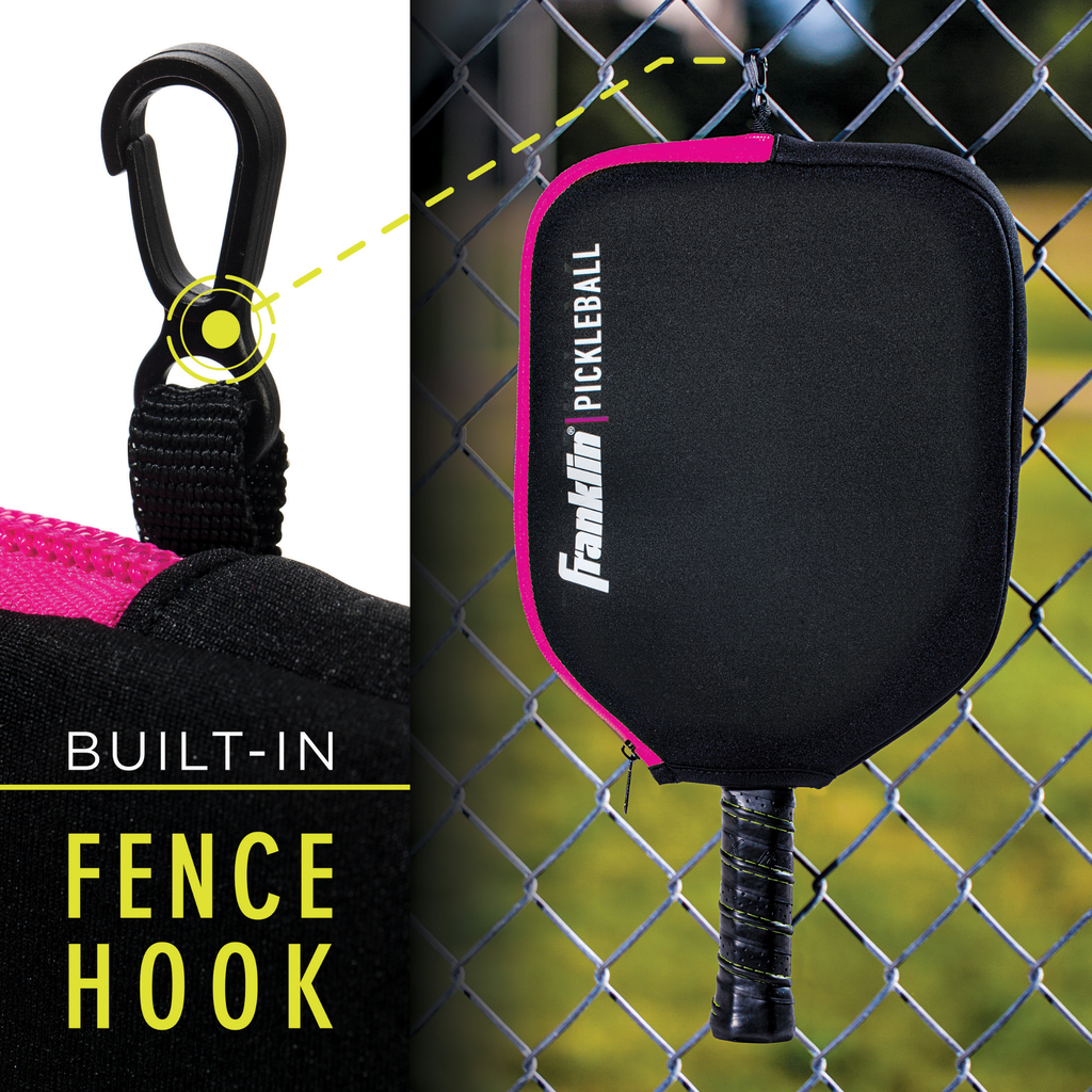 A close-up of the Franklin Single Pickleball Paddle Cover, featuring a built-in fence hook and hanging on a chain-link fence. Text reads "BUILT-IN FENCE HOOK." A Franklin paddle is partially visible inside the cover.