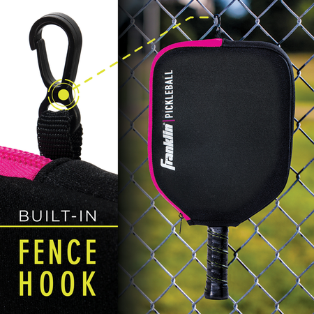 A close-up of the Franklin Single Pickleball Paddle Cover, featuring a built-in fence hook and hanging on a chain-link fence. Text reads "BUILT-IN FENCE HOOK." A Franklin paddle is partially visible inside the cover.