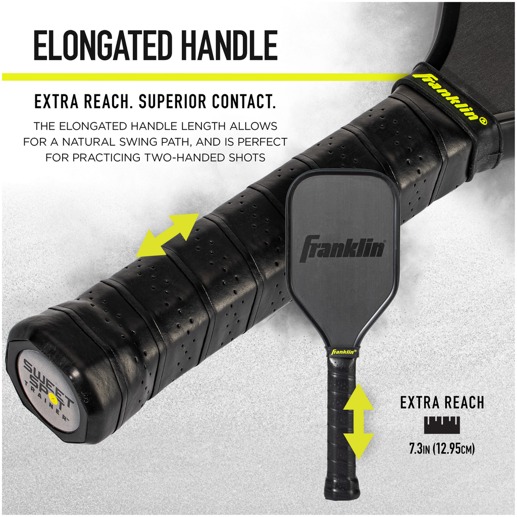 A close-up of the Franklin Sweet Spot Trainer Pickleball Paddle’s elongated handle shows arrows marking its extra 7.3-inch reach, highlighting benefits like superior contact, ideal two-handed shots, and its use as a Sweet Spot Trainer.
