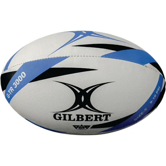 The Gilbert G-TR3000 Training Ball is a white rugby trainer with black and blue accents, the Gilbert logo, and model name printed on its durable rubber surface.