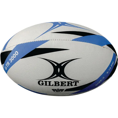The Gilbert G-TR3000 Training Ball is a white rugby trainer with black and blue accents, the Gilbert logo, and model name printed on its durable rubber surface.