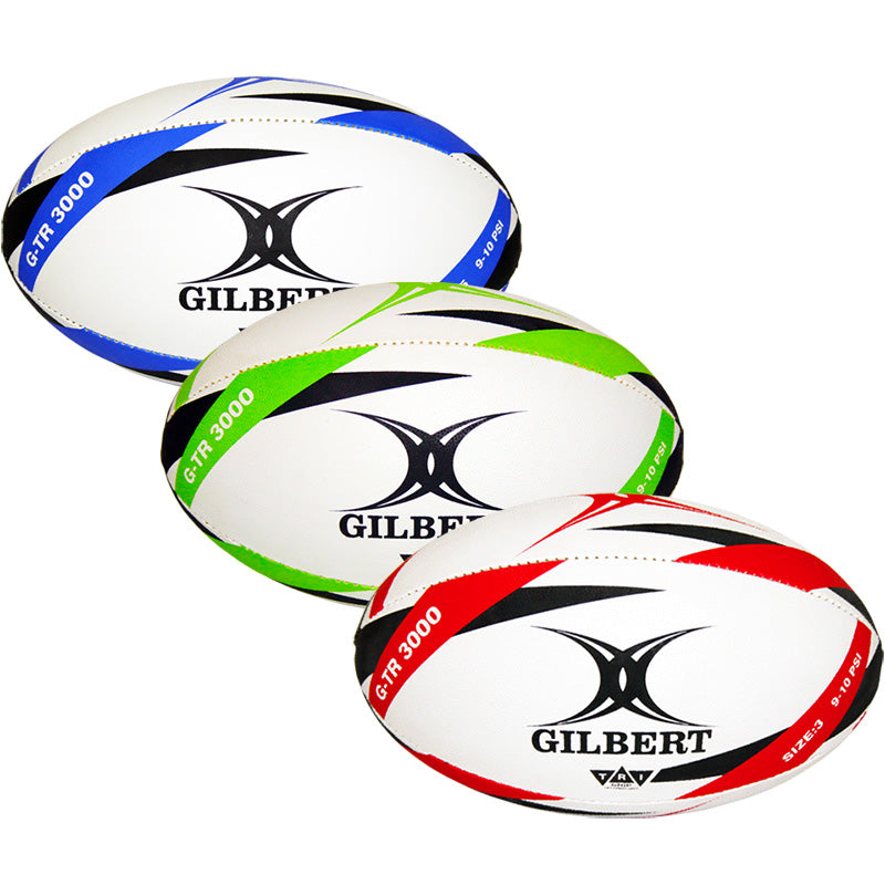 Three white Gilbert G-TR3000 Training Balls (blue, green, red accents) each feature a durable rubber surface, black Gilbert logos, and "GTR 3000" with matching colored stripes and text.