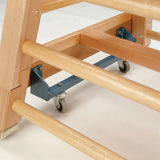 Close-up of the Niels Larsen Vaulting Bar Box - Hide Top showing its wooden construction, horizontal side rungs, metal brackets, and small caster wheels by Niels Larsen, set against a white background.