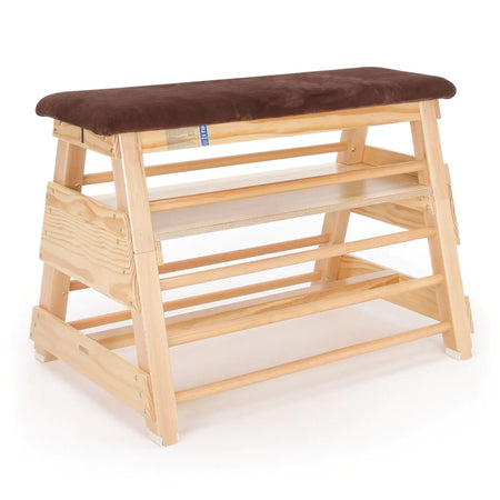 The Niels Larsen Vaulting Bar Box - Hide Top by Niels Larsen features three wooden steps, side rungs, and a cushioned natural hide top—ideal for gymnastics or physical education activities.