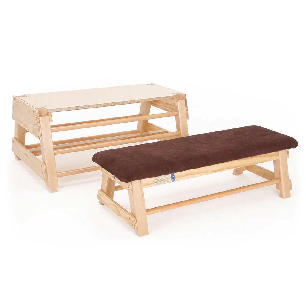 The Niels Larsen Vaulting Bar Box - Hide Top features a cushioned brown seat, sturdy frame, and side rungs, offering reliable support and classic design.
