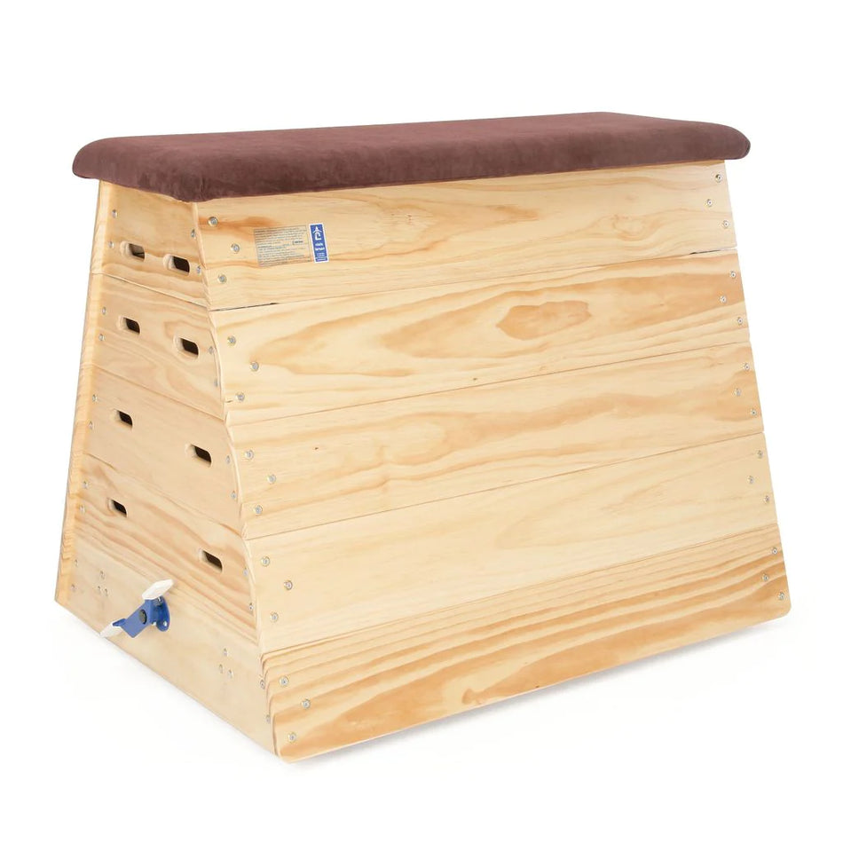The Niels Larsen Traditional Vault Box - Hide Top features a padded brown natural hide top, interlocking corner blocks, and multiple side slots—ideal for gymnastics or PE. Optional castors available. Brand: Niels Larsen.