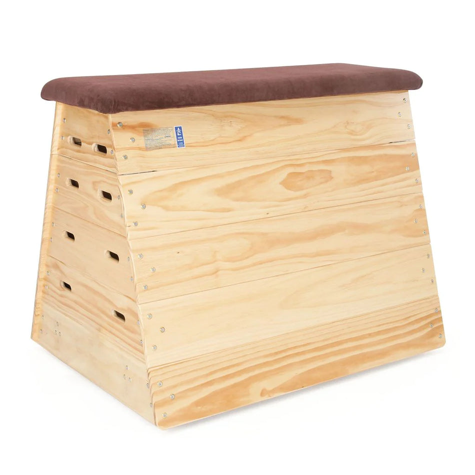The Niels Larsen Traditional Vault Box - Hide Top by Niels Larsen features a slightly slanted wooden shape with rounded edges, a padded natural hide top, side handholds, interlocking corner blocks for stability, and optional castors for easy mobility.